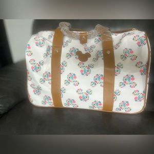 Floral Mickey roller duffel bag.